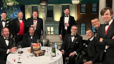 Group of St. George's Society of Baltimore Members pose on the Maryland Club's Porch